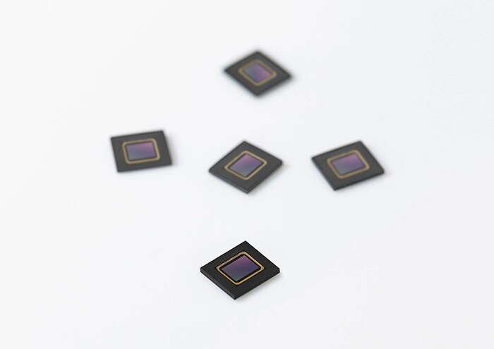 An image of several ISOCELL Auto 4AC products placed on a white background.