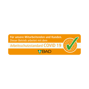 Orange safety certification badge with a green checkmark indicating compliance with the COVID-19 occupational safety standard from BAD.
