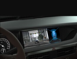 An in-car dashboard display showing a live road view with a vehicle detection system using surround-view sensor technology.