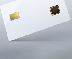 A close-up of a sleek white smart card with a gold chip on the left and a dark square sensor on the right. 