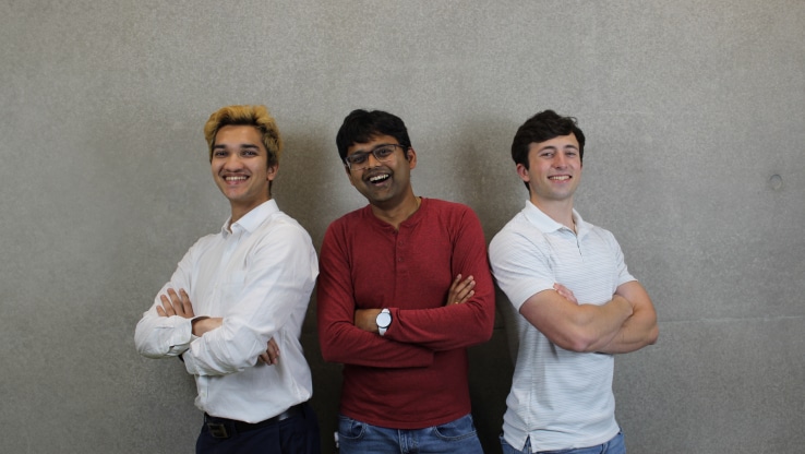 A group of three SARC/ACL interns posing together with crossed arms.