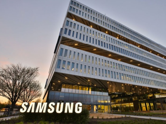 A photo of a US office building with Samsung logo in front.