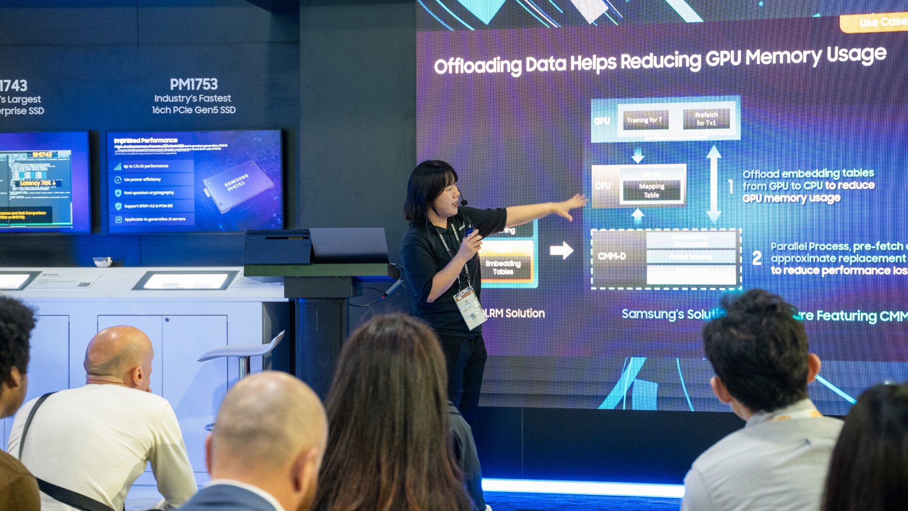 A presenter explaining Samsung’s CMM-D solution with diagrams showing how data offloading reduces GPU memory usage.