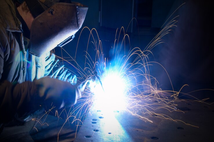 Welder working on metal