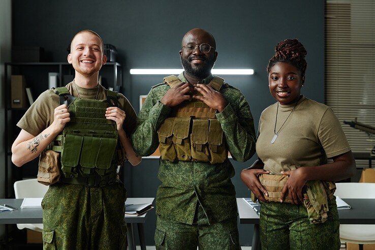 Three people in military uniforms