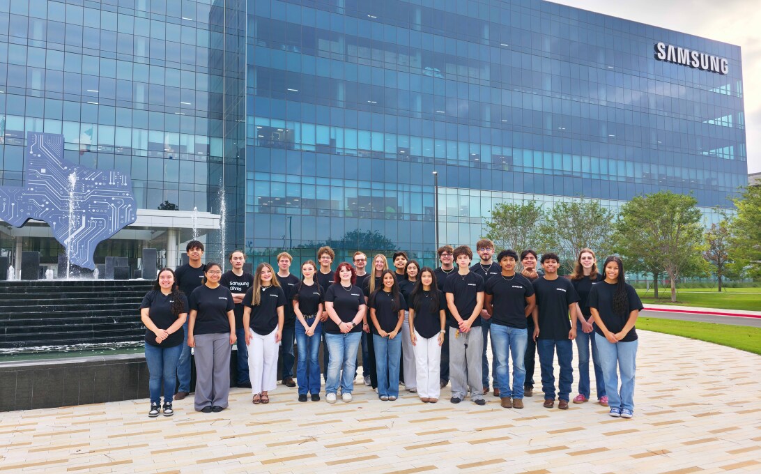 Group photo outside a Samsung facility