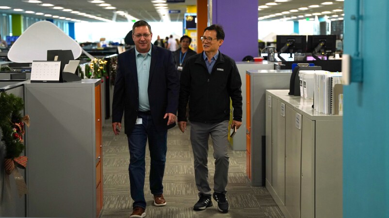 Rafael Lainez with a colleague at theSamsung Austin Semiconductor office.