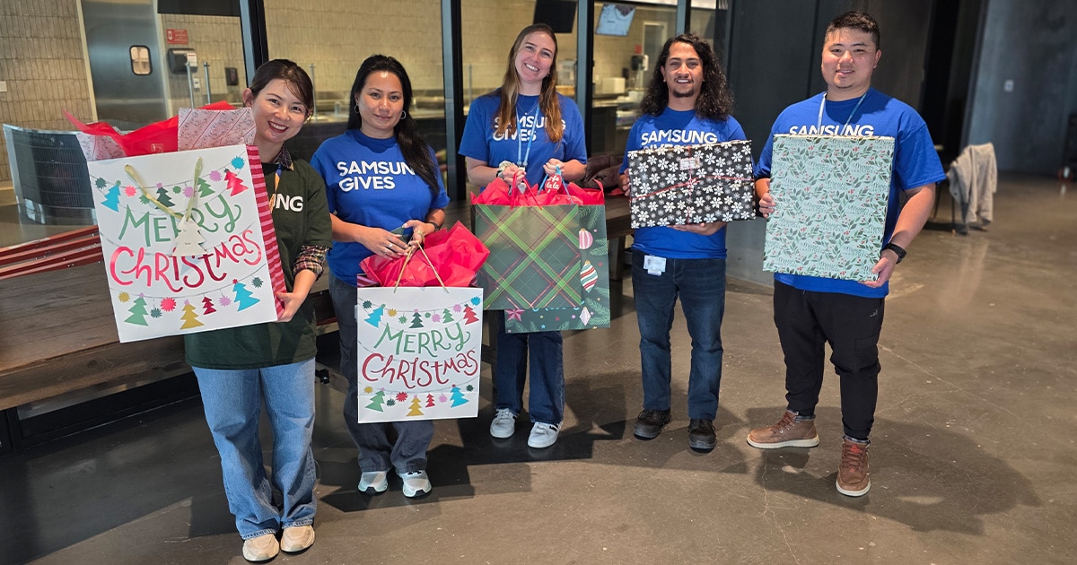 Samsung Austin Semiconductor employees with their gifts for children from the Boys and Girls Club of East Williamson County.