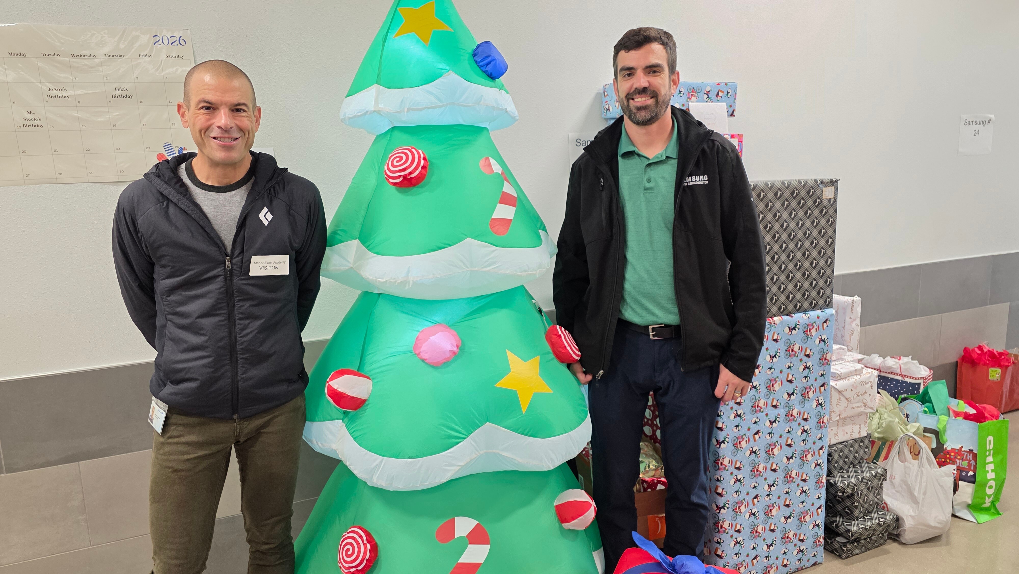 Michael Karpkinski, left, and his colleague Nic Alford, dropping off their donations at Manor Excel Academy. 