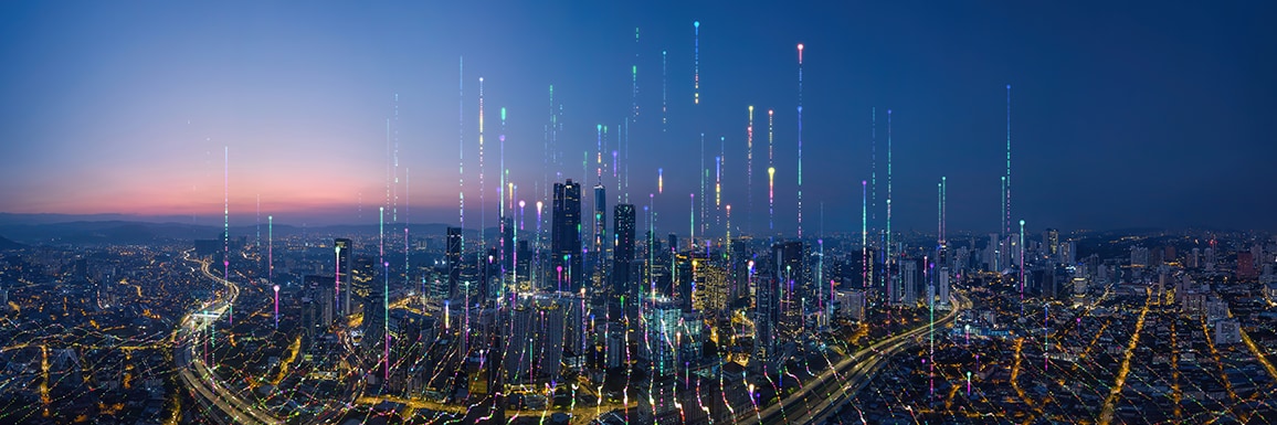 A futuristic cityscape at dusk, featuring vibrant light streams rising from skyscrapers.