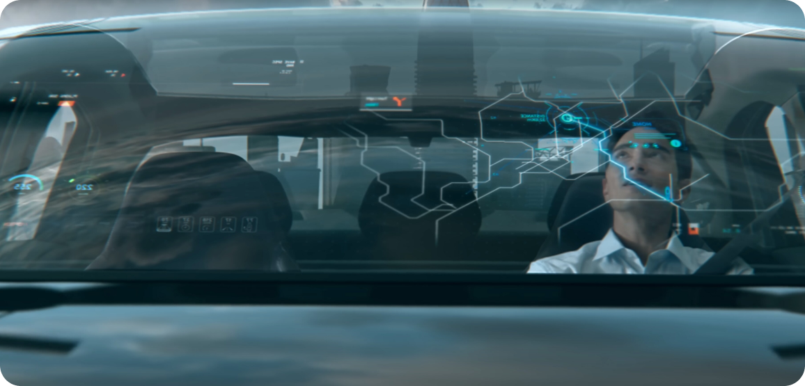 A man inside a futuristic car interacting with an augmented reality windshield displaying navigation and system diagnostics.