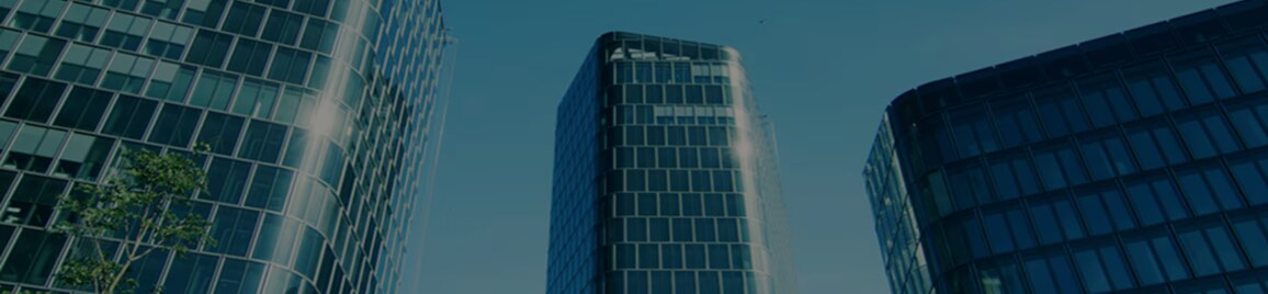 View from below of three office towers.