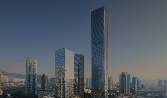 A panoramic view of modern skyscrapers in a Chinese metropolis, dominated by a sleek, ultra-tall office tower.