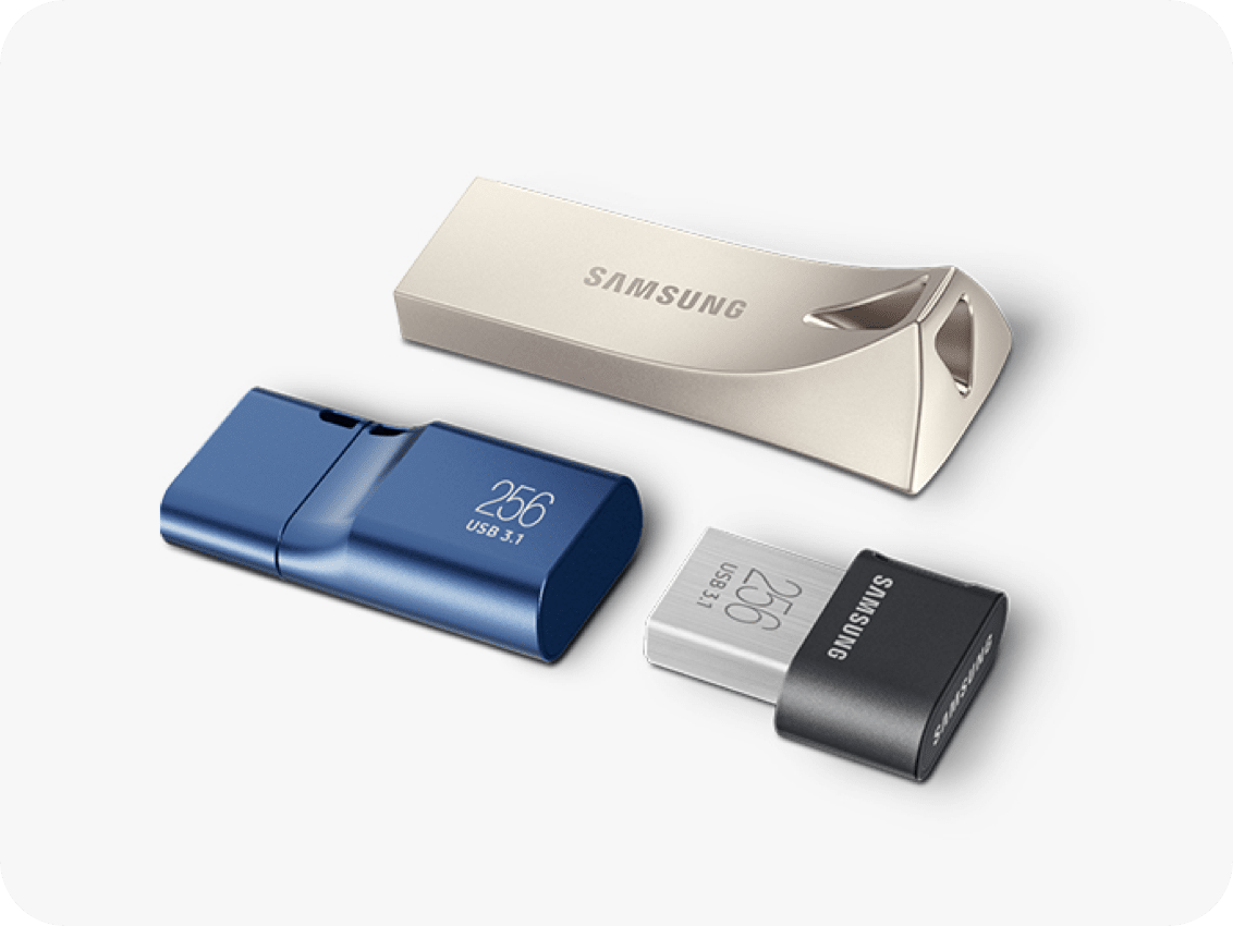 Three USB flash drives are perpendicular to each other. The Bar Plus USB 3.1 Flash Drive (2020) in Silver in on top of the blue USB Flash Drive Type-C™ 256GB and FIT Plus USB 3.1 Flash Drive (2020) in black.
