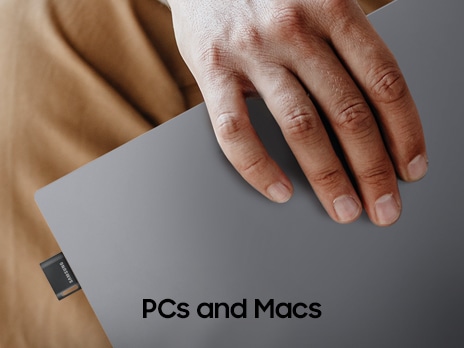 The FIT Plus is plugged into a laptop, and one person is holding the laptop in their hand. Below it, it says 'PCs and Macs'.