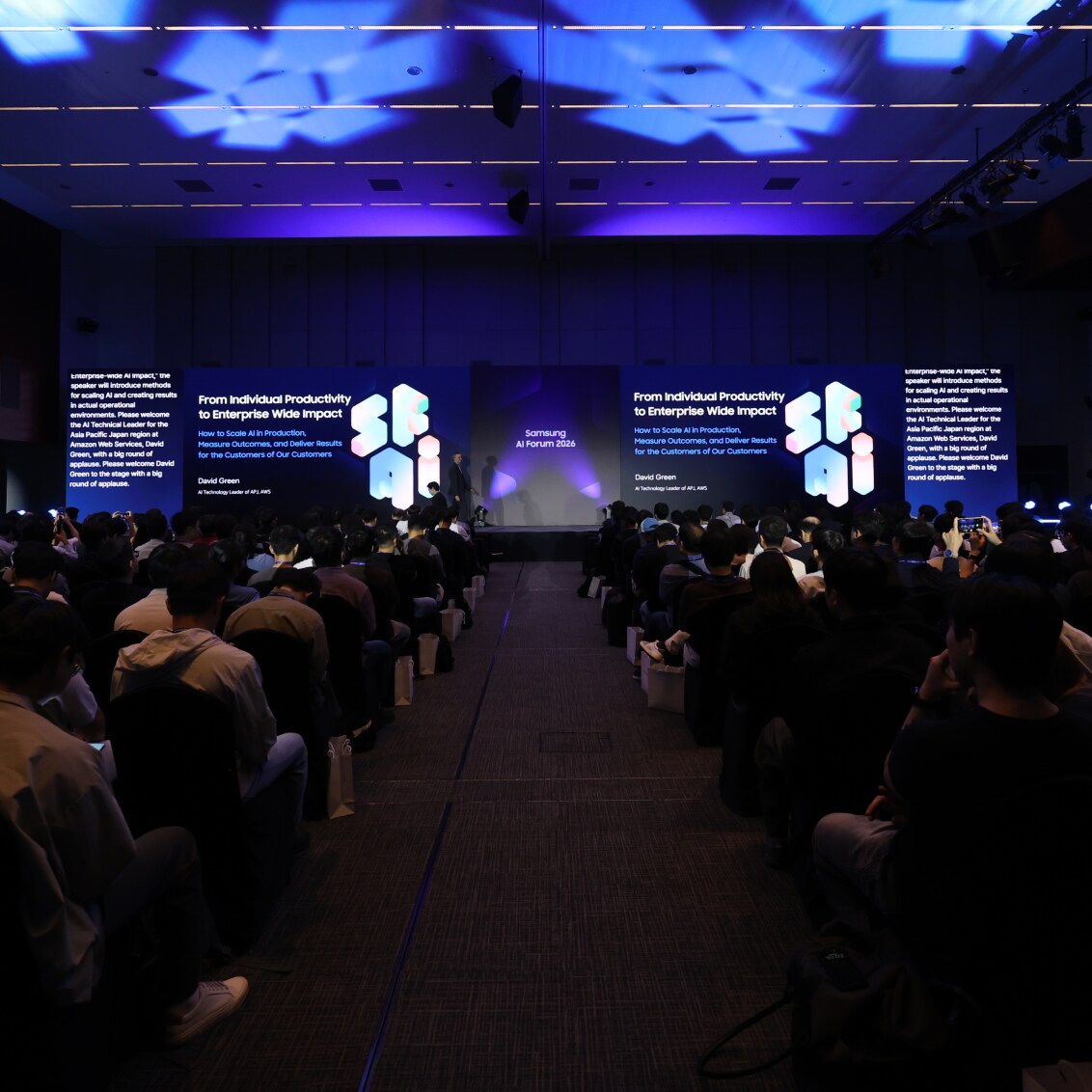 Audience attending a presentation on stage at Samsung AI Forum 2026
