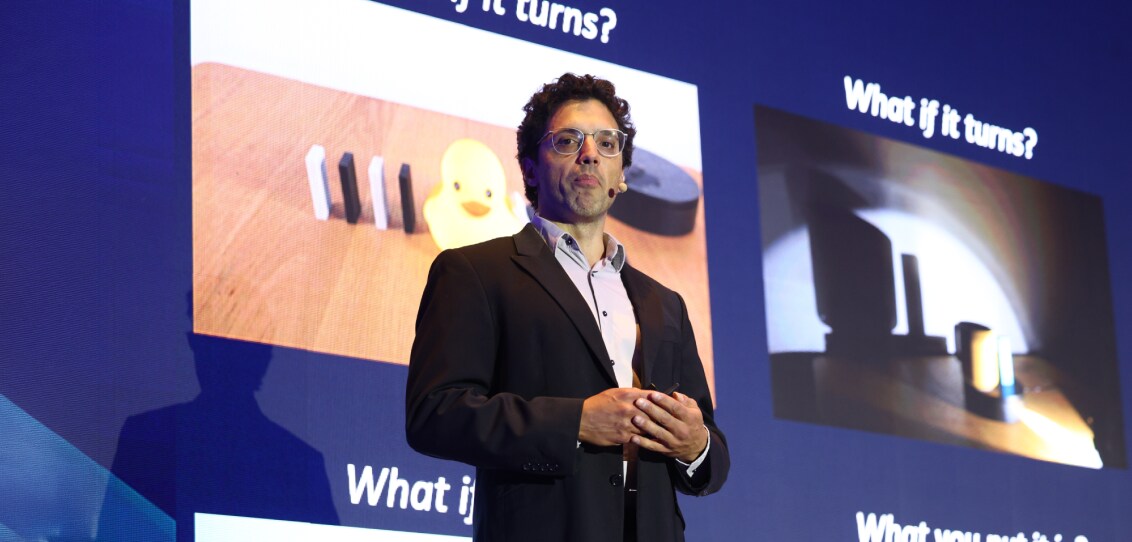 Timothy Hospedales, VP, presenting on Physical AI on stage