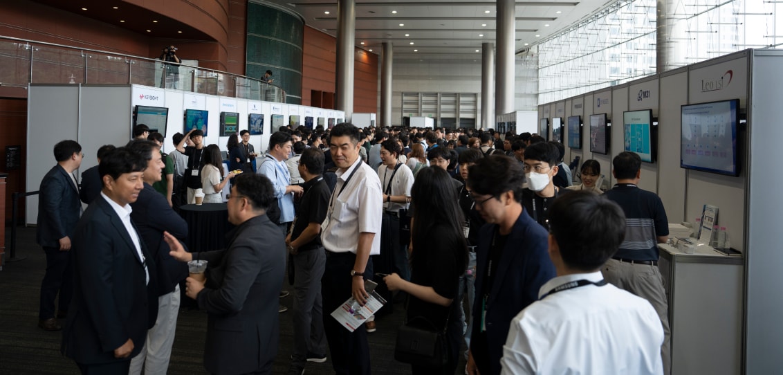 The Partner Pavilion with numerous attendees networking and visiting informational booths.