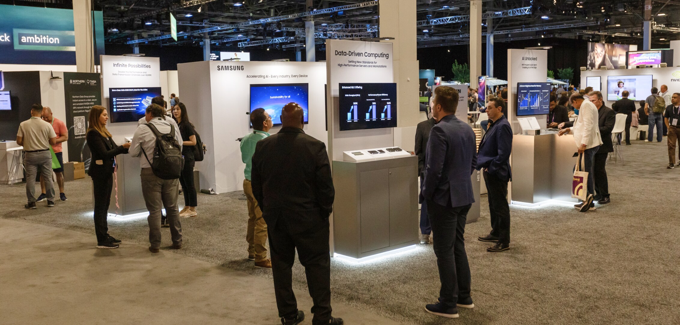 Attendees exploring various Samsung exhibits at HPE Discover 2024, including Data-Driven Computing, AI Unlocked, and other technological advancements.