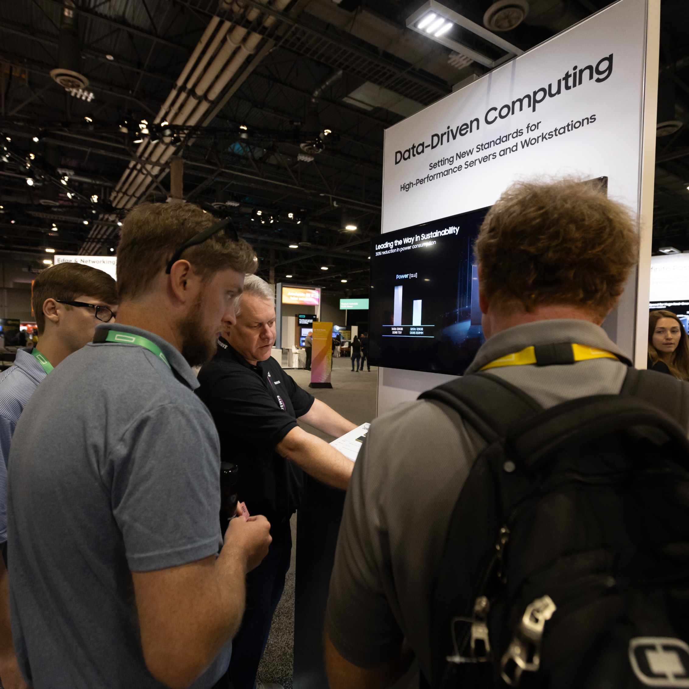 Attendees at HPE Discover 2024 gathering around a Samsung Data-Driven Computing display, learning about new standards for high-performance servers and workstations.