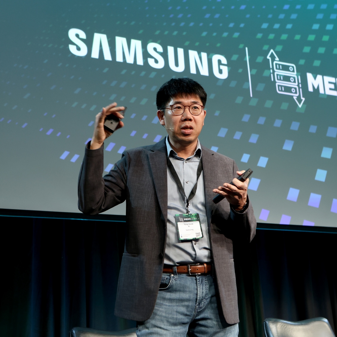A presenter gesturing during MEMCON 2024 with the Samsung logo displayed in the background.
