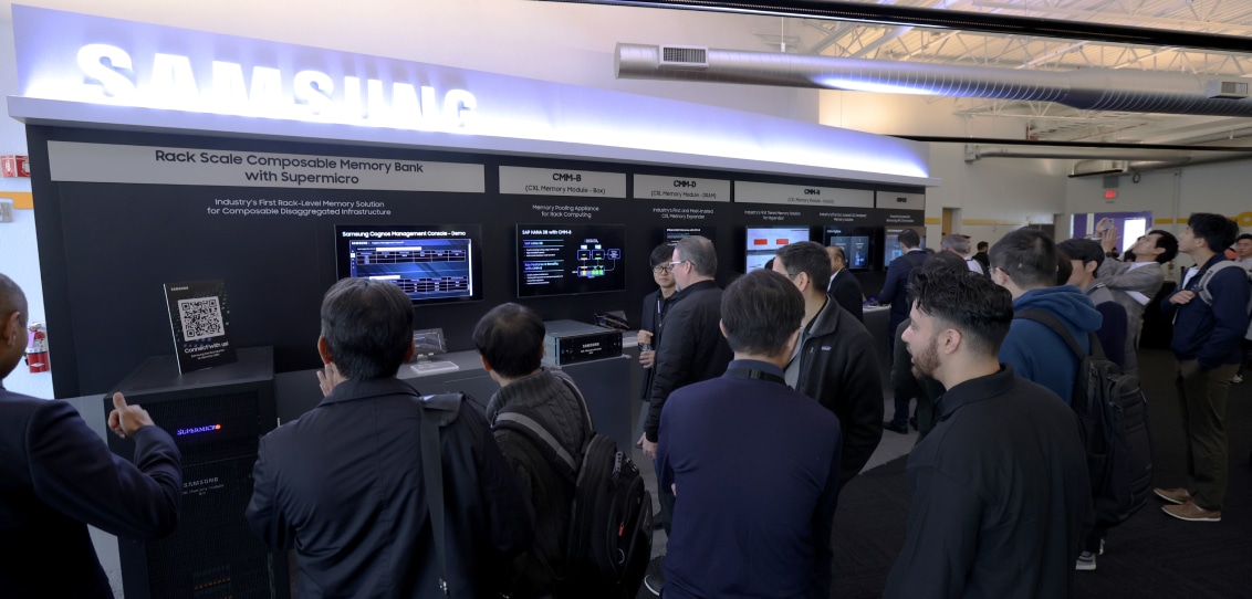 Attendees at MEMCON 2024 examining a Samsung exhibition stand about Rack Scale Composable Memory Banks.
