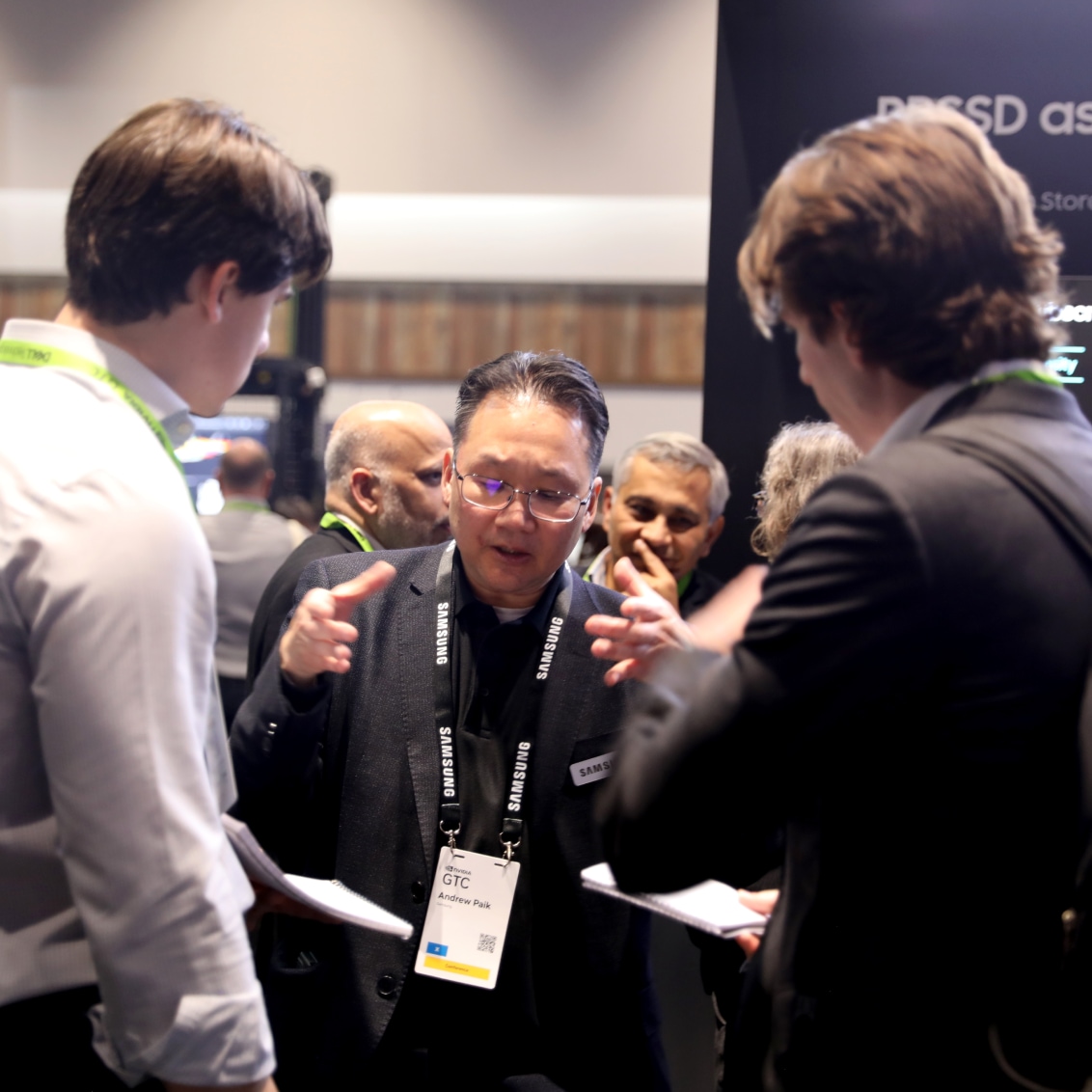 A group of professionals in a lively discussion at NVIDIA GTC 2024