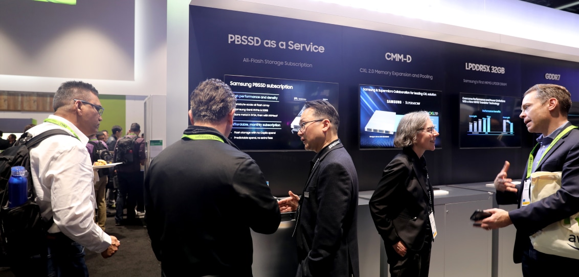 Professionals engaging in discussions at a booth advertising PBSSD as a Service at NVIDIA GTC 2024