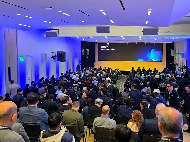 The SAFE™ Forum 2026 hosts a full-capacity session in a modern, well-lit conference hall, with attendees focused on a main stage presentation.