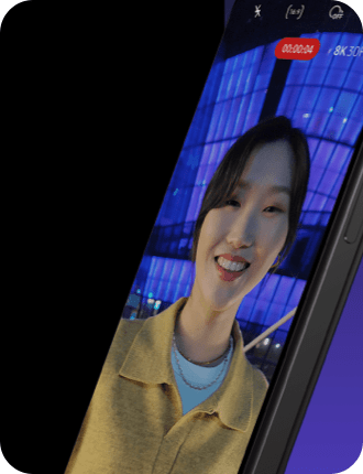 an 8K video of a smiling woman in yellow is being played on a smartphone.