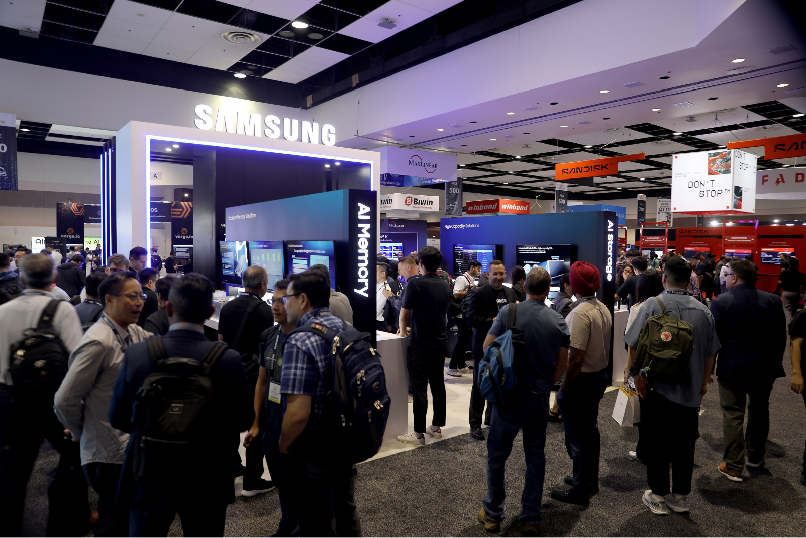 Samsung Semiconductor booth showcasing AI Memory and AI Storage solutions at a technology exhibition, with many visitors.