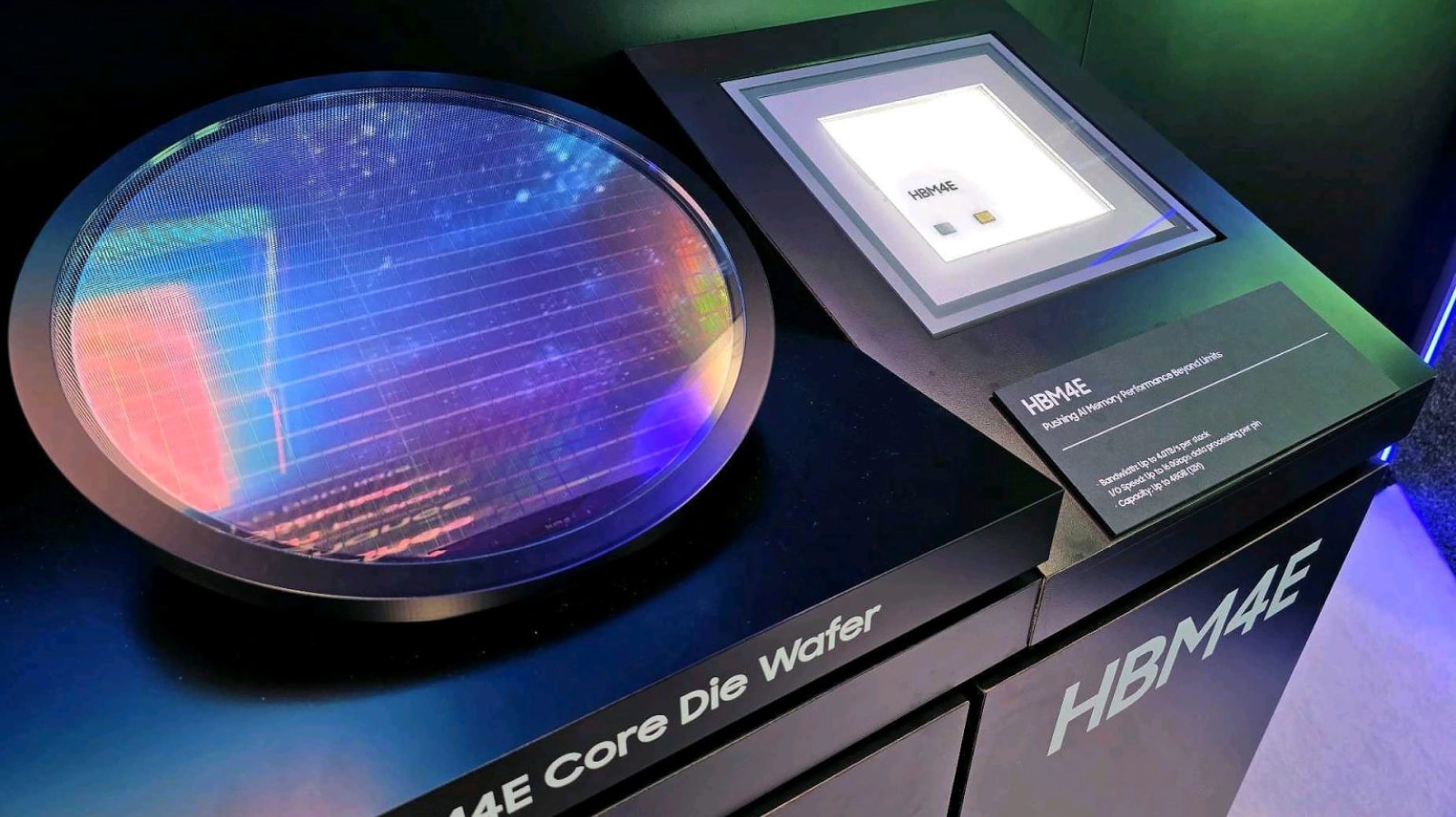 Physical exhibition display featuring the Samsung HBM4E Core Die Wafer and an individual HBM4E memory chip, showcasing next-generation AI memory technology.