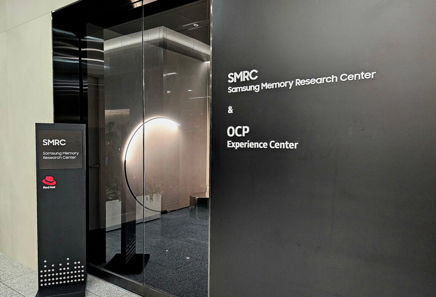 Entrance to the Samsung Memory Research Center (SMRC) and the OCP Experience Center, featuring signage with the Red Hat logo