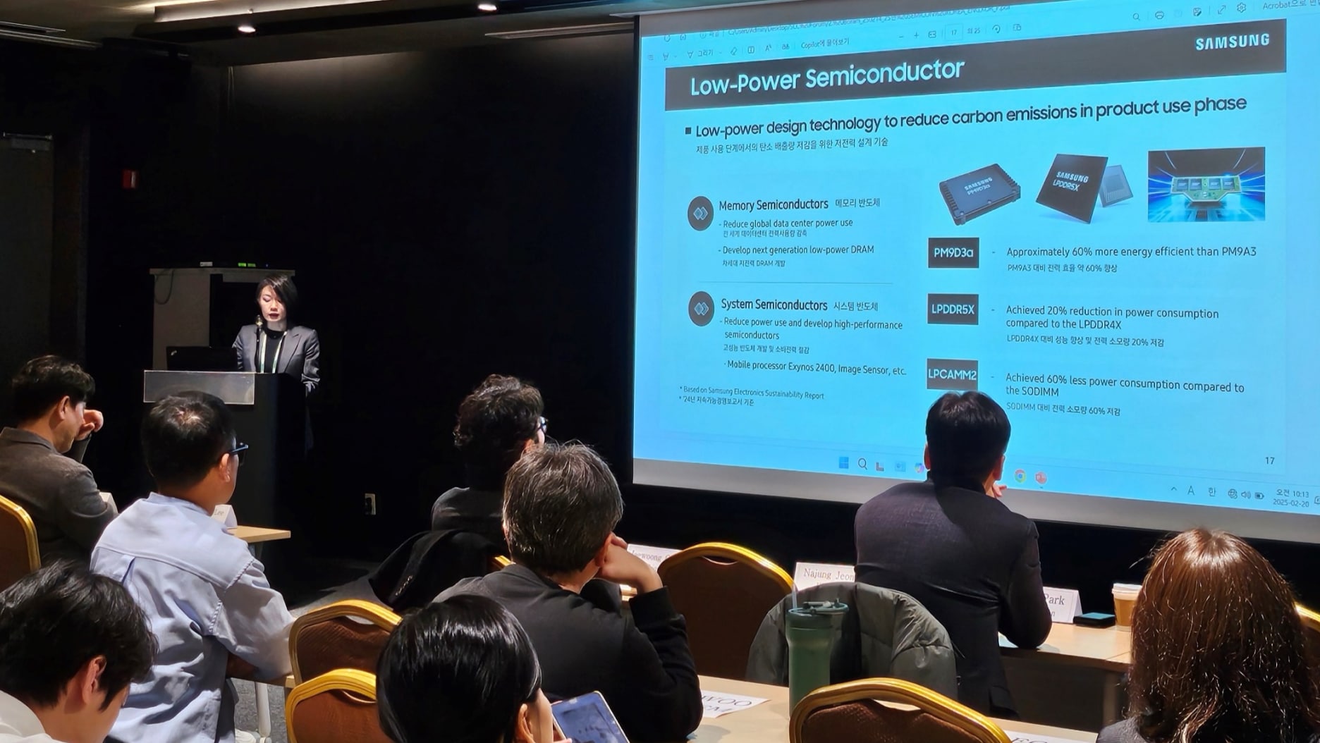 A presenter discusses Samsung’s low-power semiconductor technology with a detailed slide.