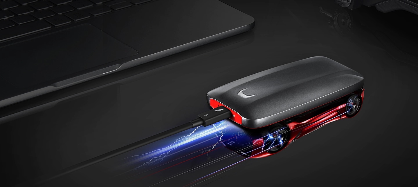 Samsung Portable SSD X5 connected to the Thunderbolt™ 3 ports and the racing car is reflected on the surface.