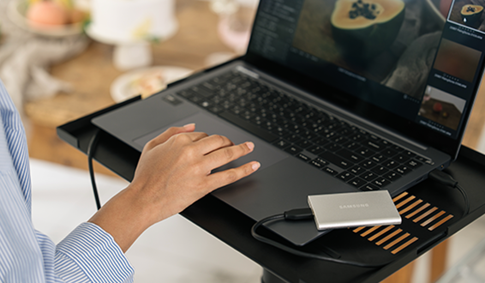 A woman working on editing at her laptop