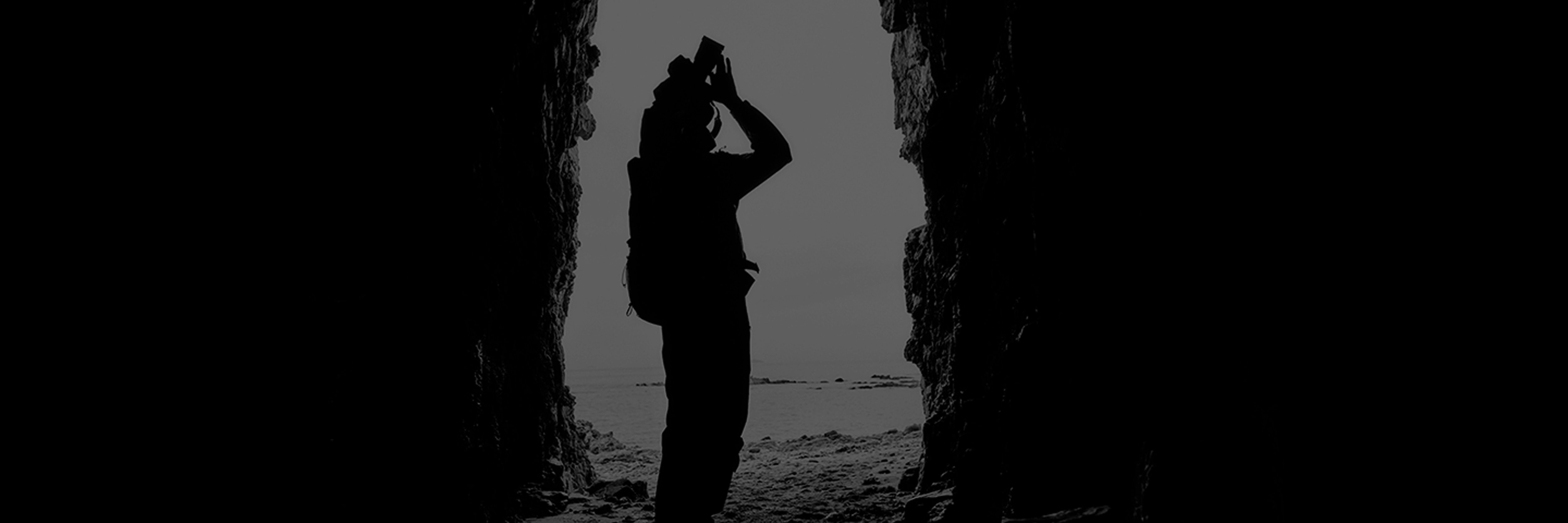 A photographer shooting in front of the sea