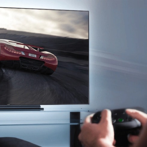 An illustrative image of a person playing gaming console connected to a tv.