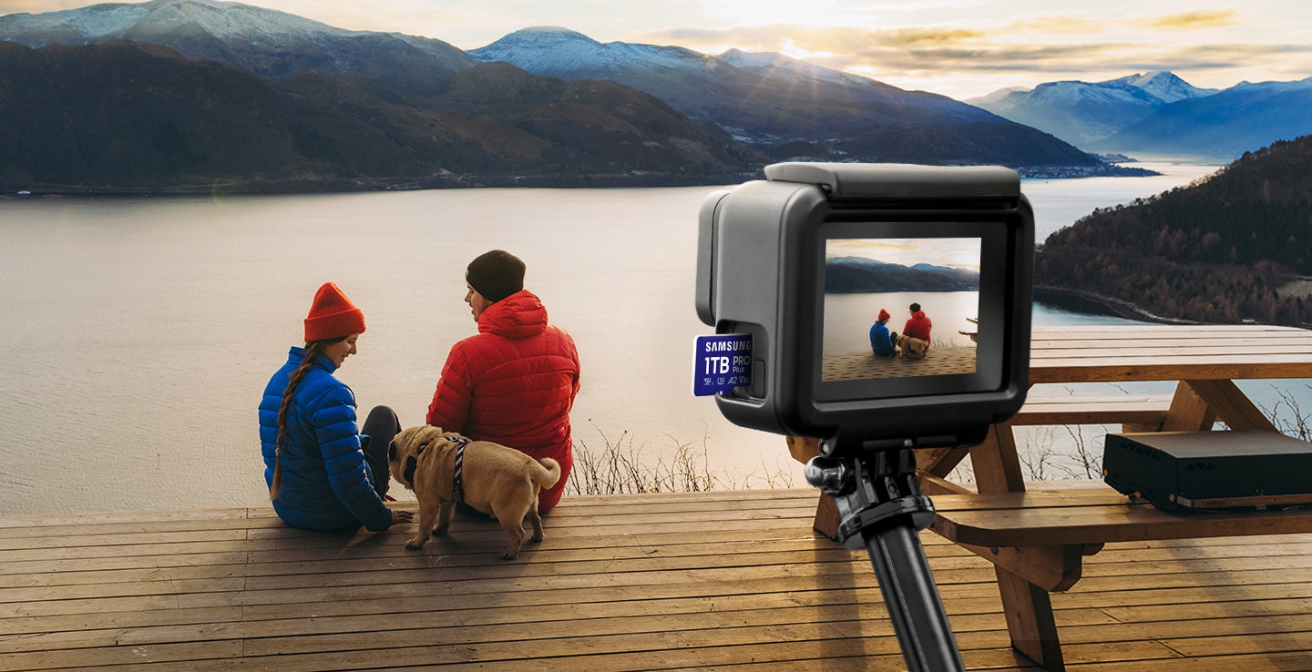 An action camera with a Samsung PRO Plus plugged in is taking pictures of people and landscapes.