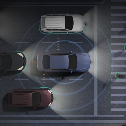 An illustrative image of a vehicle detecting surrounding vehicles and people.